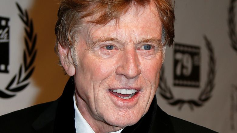 Robert Redford smiling in scarf
