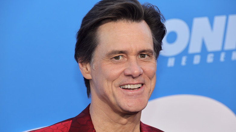 Jim Carrey smiles at the camera