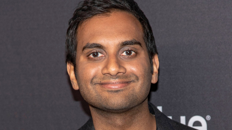 Aziz Ansari smiles