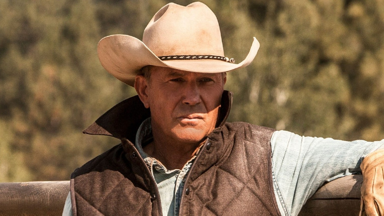 Kevin Costner wears a cowboy hat