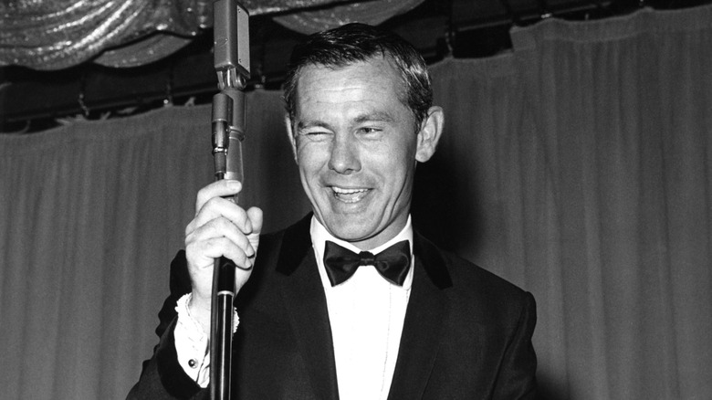 Johnny Carson performing for a crowd