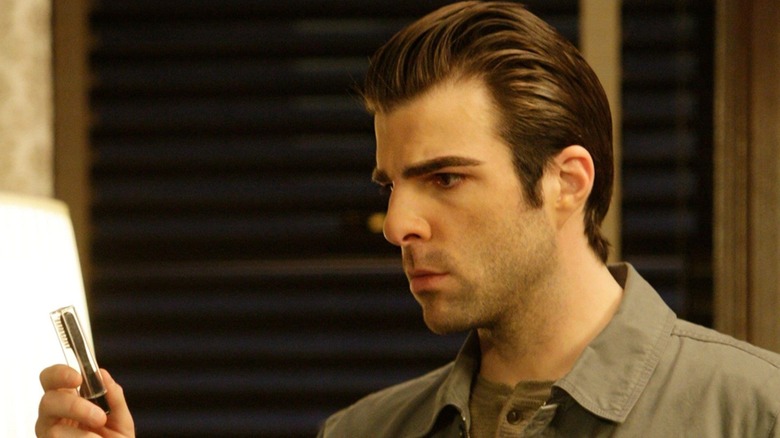 Sylar examines an object