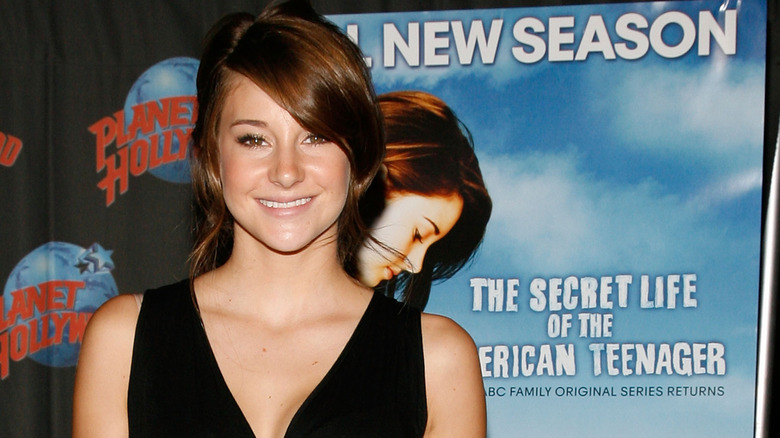 Shailene Woodley in front of a poster for The Secret Life of the American Teenager (2008)