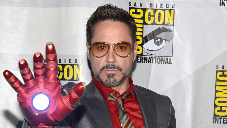 Robert Downey Jr. wearing an Iron Man glove at Comic-Con