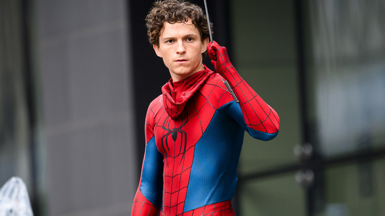 Tom Holland on set in the Spider-Man costume