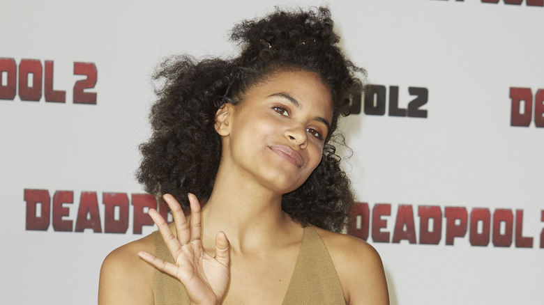 Zazie Beetz smiling and waving at the "Deadpool 2" premiere