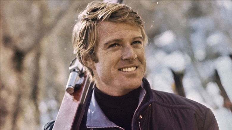Robert Redford smiling in a scene from 