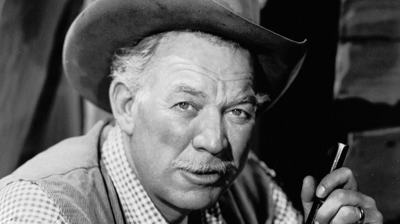 Ward Bond posing for photo