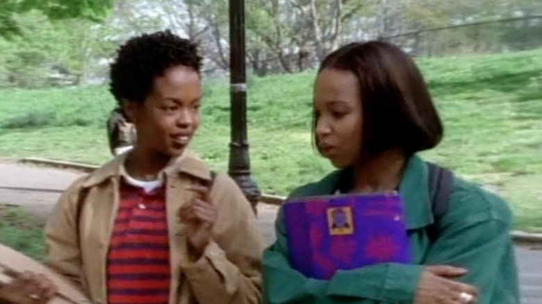 Malika and Alicia walk across campus