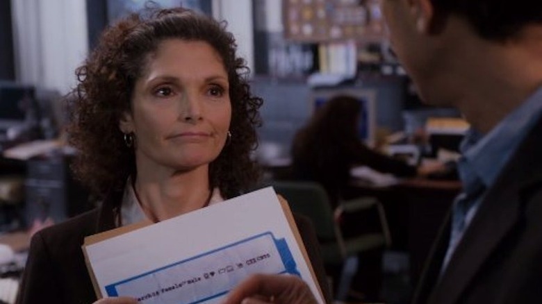 Zoe Callas holding a folder