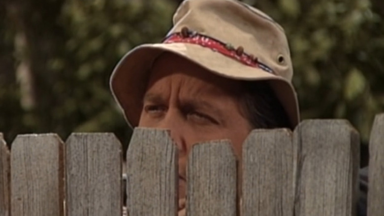 Wilson peers over fence