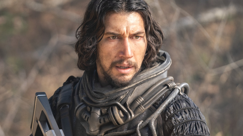 Adam Driver wears a spacesuit