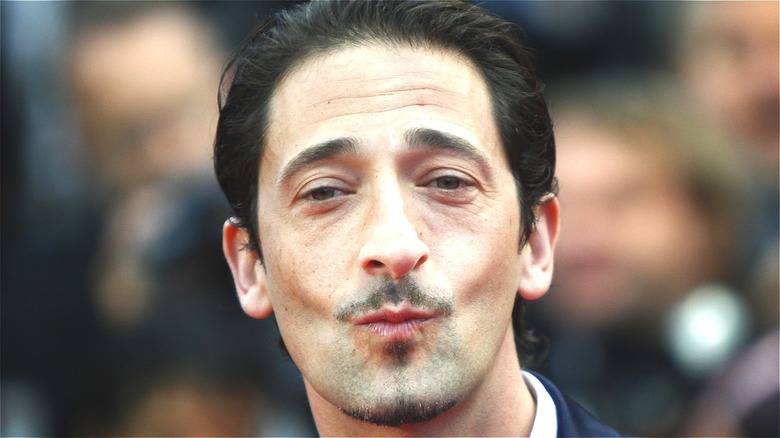 Adrien Brody pursing his lips