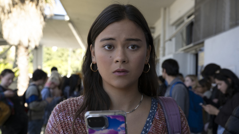 Iris holding phone nervously