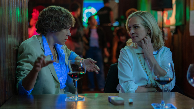 Dr. Sayers and Alma talk over drinks in "After the Hunt" (2025)