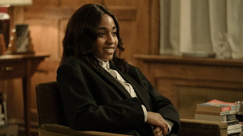 Maggie sits in a chair in "After the Hunt" (2025)