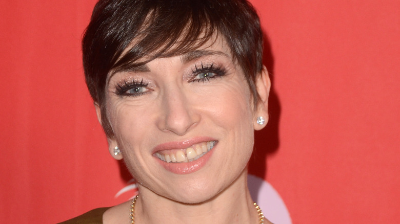 Naomi Grossman smiles brightly. 