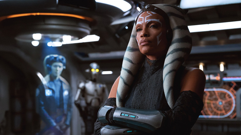 Ahsoka looking stern in a room with a hologram and C3PO in Ahsoka