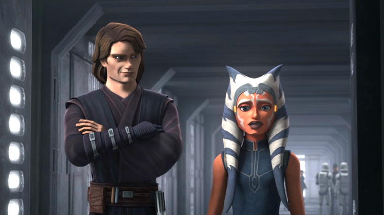 Anakin and Ahsoka stand in a hallway