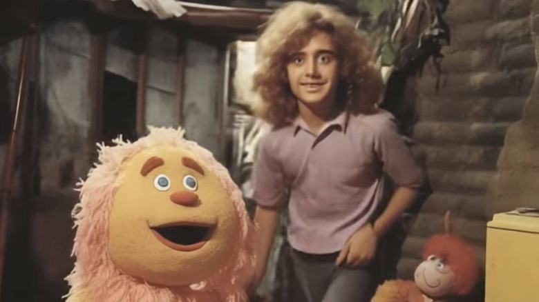 Person and puppet character posing