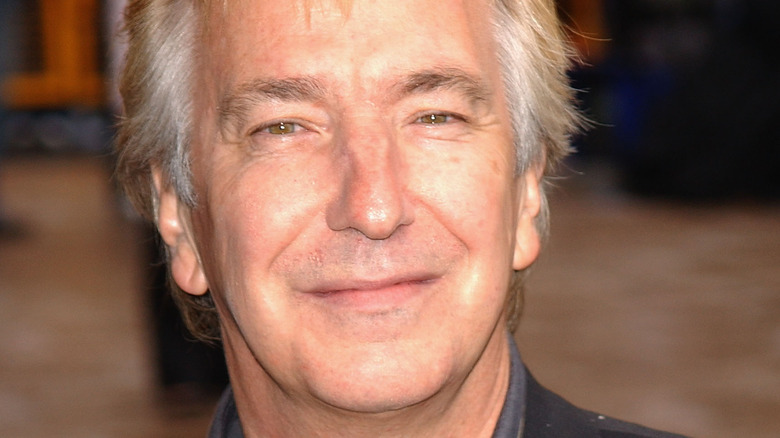 Alan Rickman poses for a photo