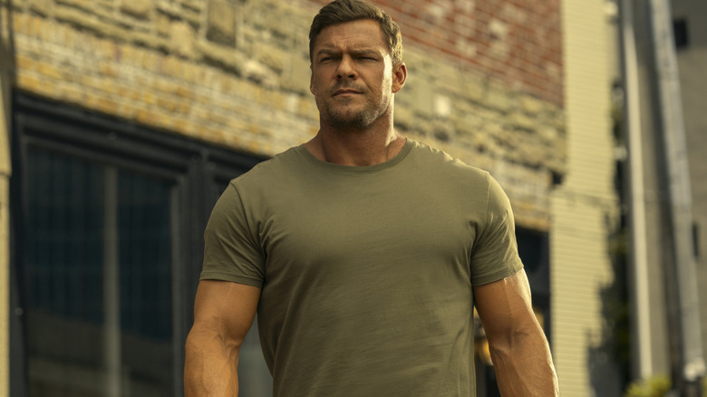 Jack Reacher walking down a sidewalk on "Reacher" (2022-present)