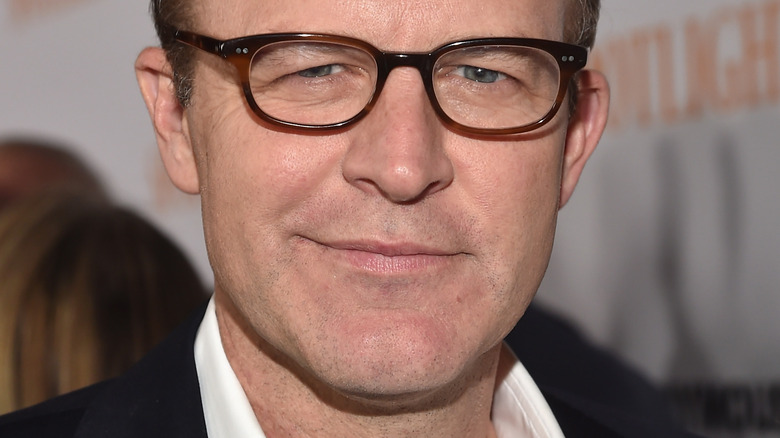 Tom McCarthy glasses closed smile