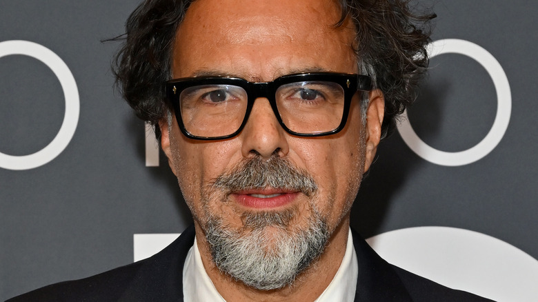 Alejandro González Iñárritu smiles slightly