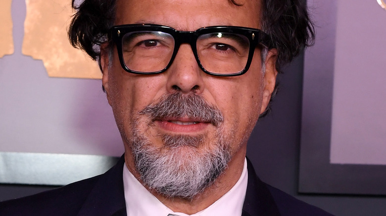 Alejandro G. Iñárritu looks at camera with glasses