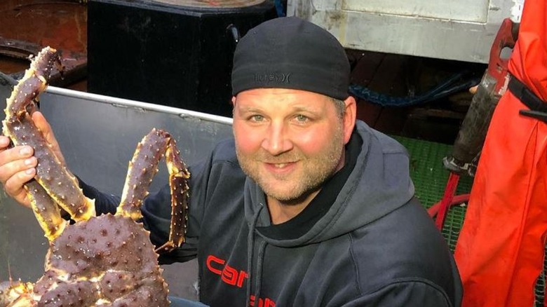 Captain Rick Shelford holding a crab