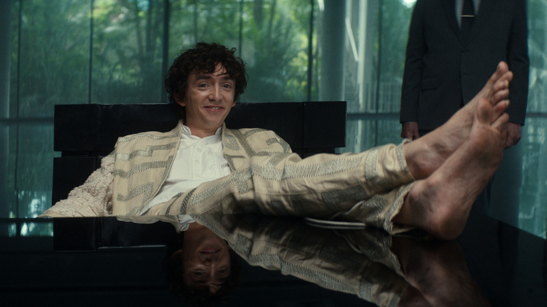 Boy Kavalier puts his bare feet on his desk in Alien: Earth"