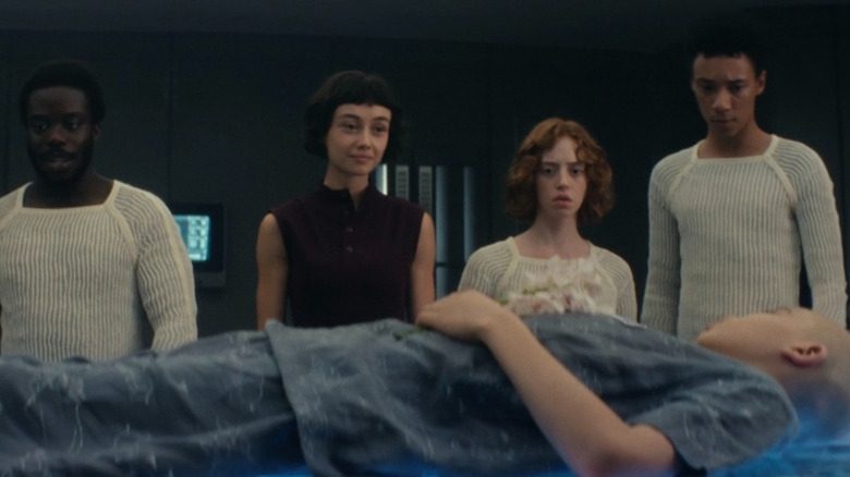Wendy and the other hybrids watching the transfer process on Alien: Earth