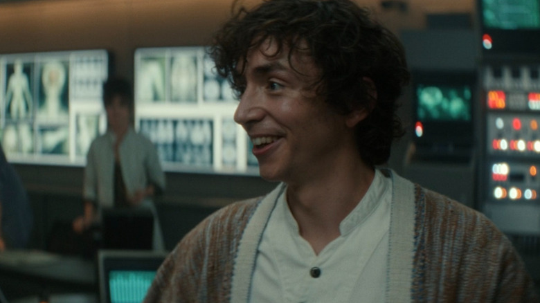 Trillionaire Boy Kavalier smiling with delight over the alien specimens found by his team on the SS Maginot