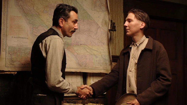 Daniel Plainview shaking hands with Eli in "There Will Be Blood" (2007)
