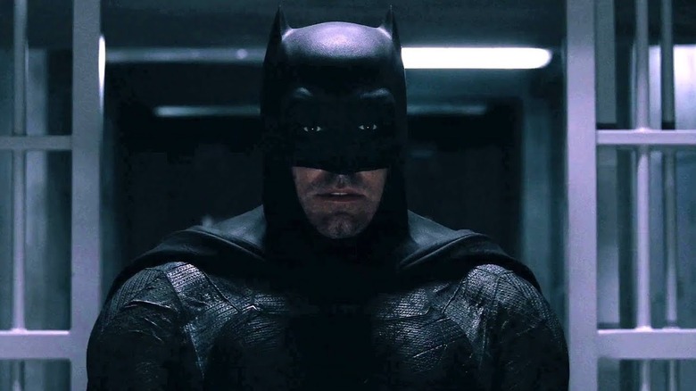 Batman looking concerned in his Batcave in Batman v Superman: Dawn of Justice (2016)