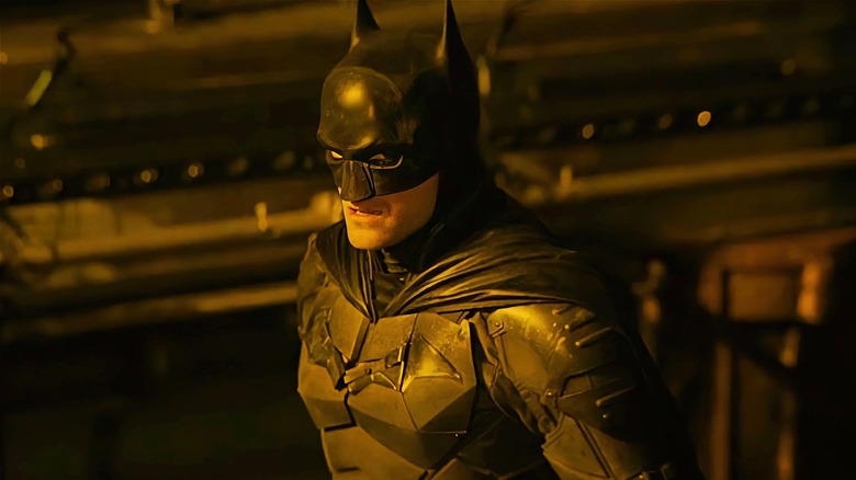 Batman looking to the side with a grimace in The Batman (2022)