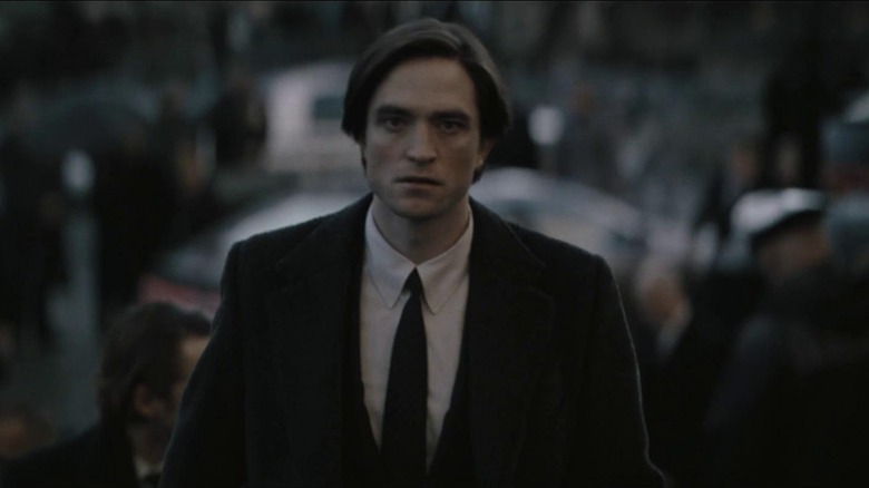 Bruce Wayne approaching a funeral in The Batman (2022)