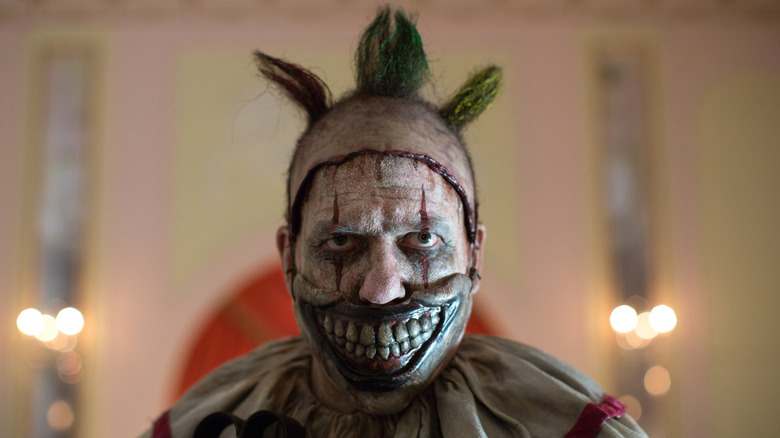 Twisty the Clown stares in "American Horror Story: Freak Show"