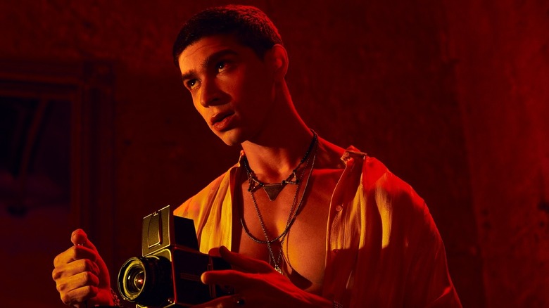 Theo Graves with a camera in "American Horror Story: NYC"