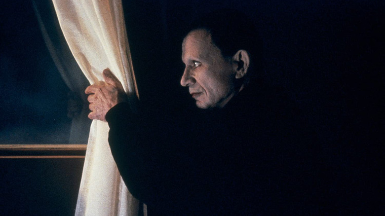 The Mystery Man looks out a window in "Lost Highway" (1997)