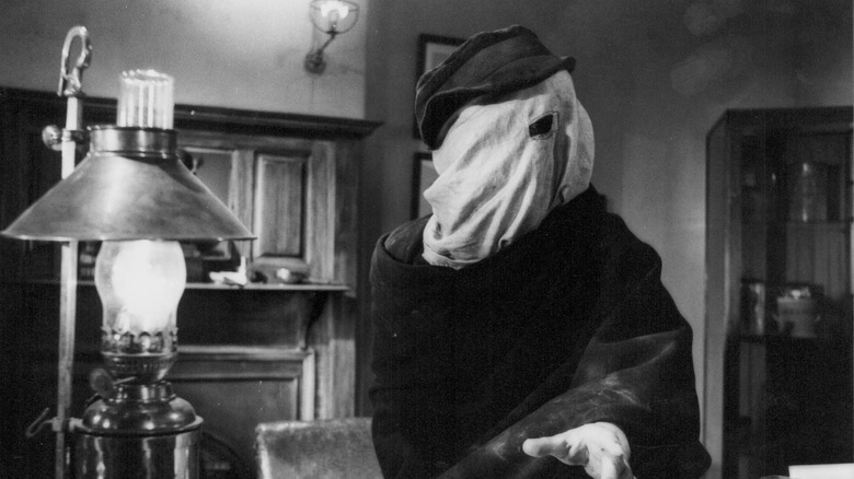 John Merrick sits in a doctor's office in "The Elephant Man" (1980)