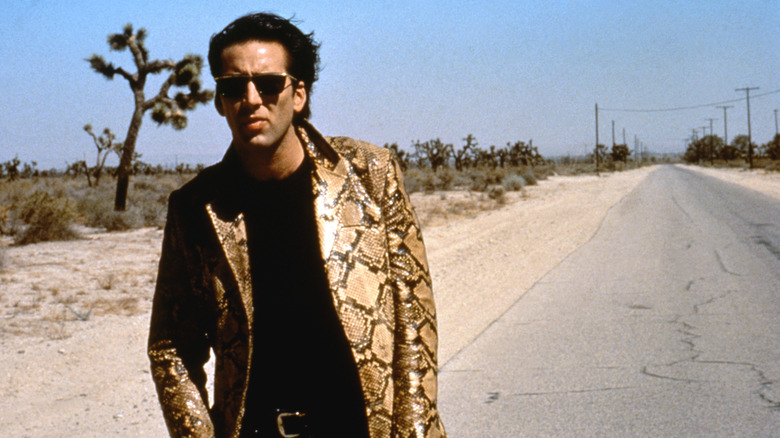 Sailor walks down a desert road in "Wild at Heart" (1990)