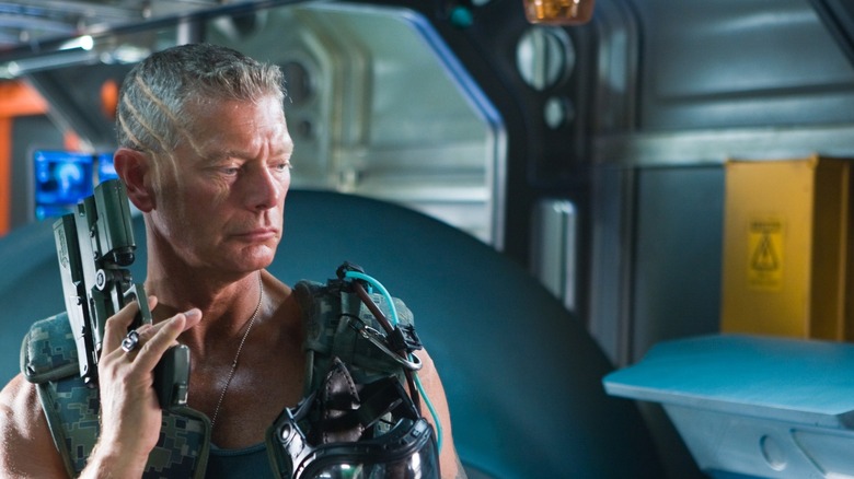 Miles Quaritch awakening Jake Sully in Avatar (2009)