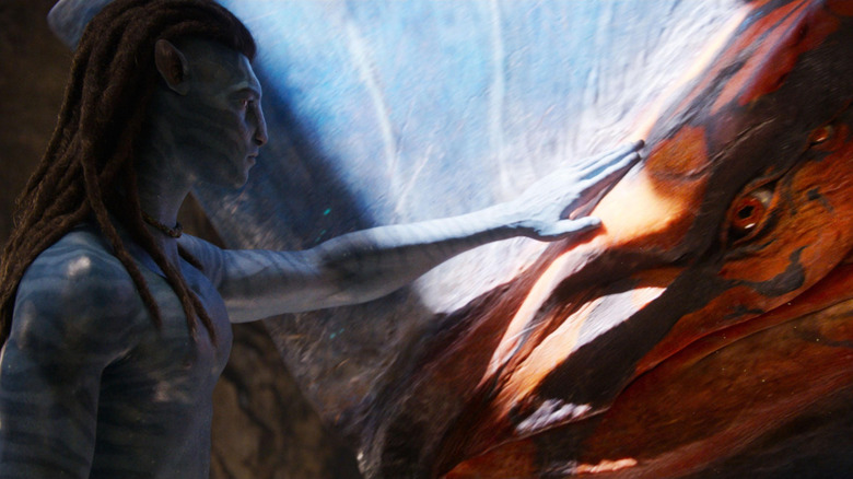 Jake Sully reaching out to an old Banshee pal in Avatar: Fire and Ash (2025)