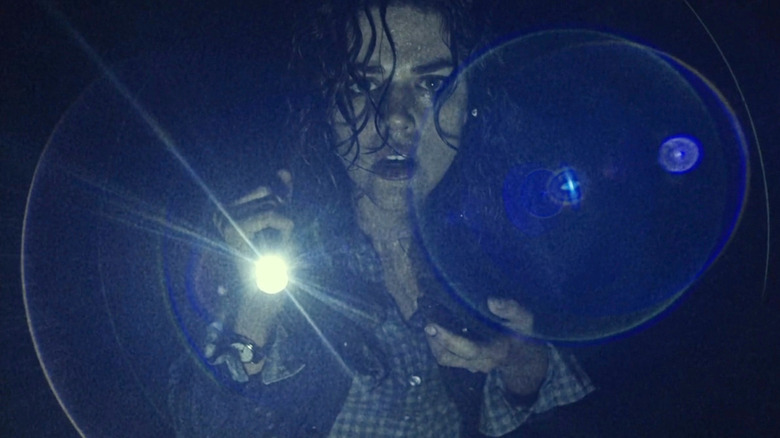 Lisa confused in the woods in "Blair Witch" (2016)