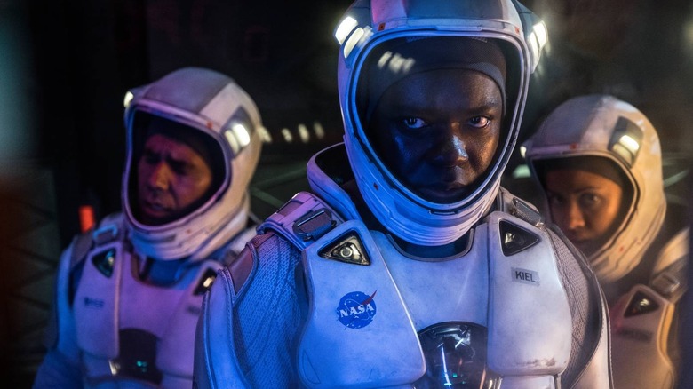 Monk, Kiel, and Ava in spacesuits in "The Cloverfield Paradox" (2018)