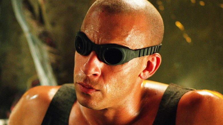 Riddick looking around with his goggles on in 