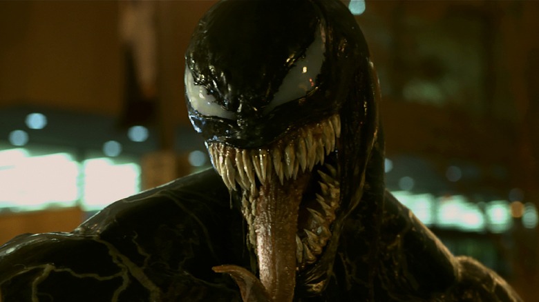 Venom roaring and sticking out tongue in Venom (2018)