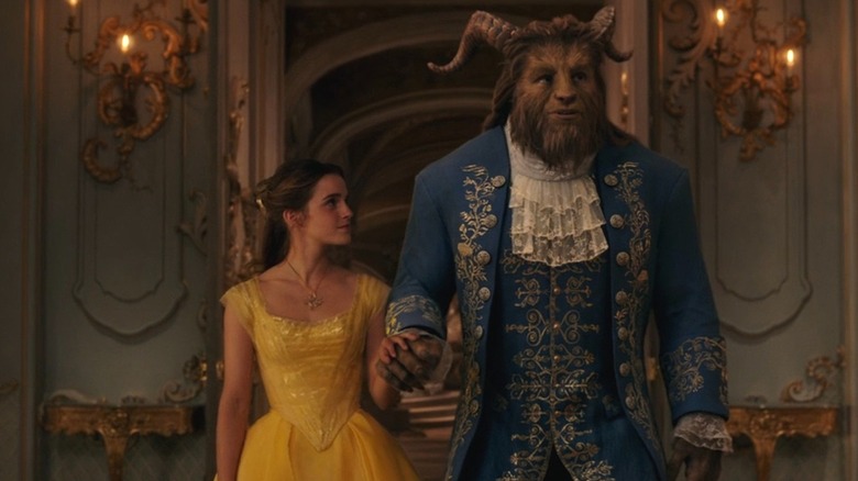 Belle walking side by side with the Beast in their ballroom attire in Beauty and the Beast