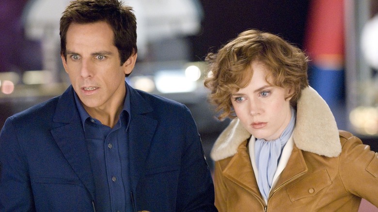 Larry and Amelia Earhart looking down with stunned expressions in Night at the Museum: Battle of the Smithsonian (2009)